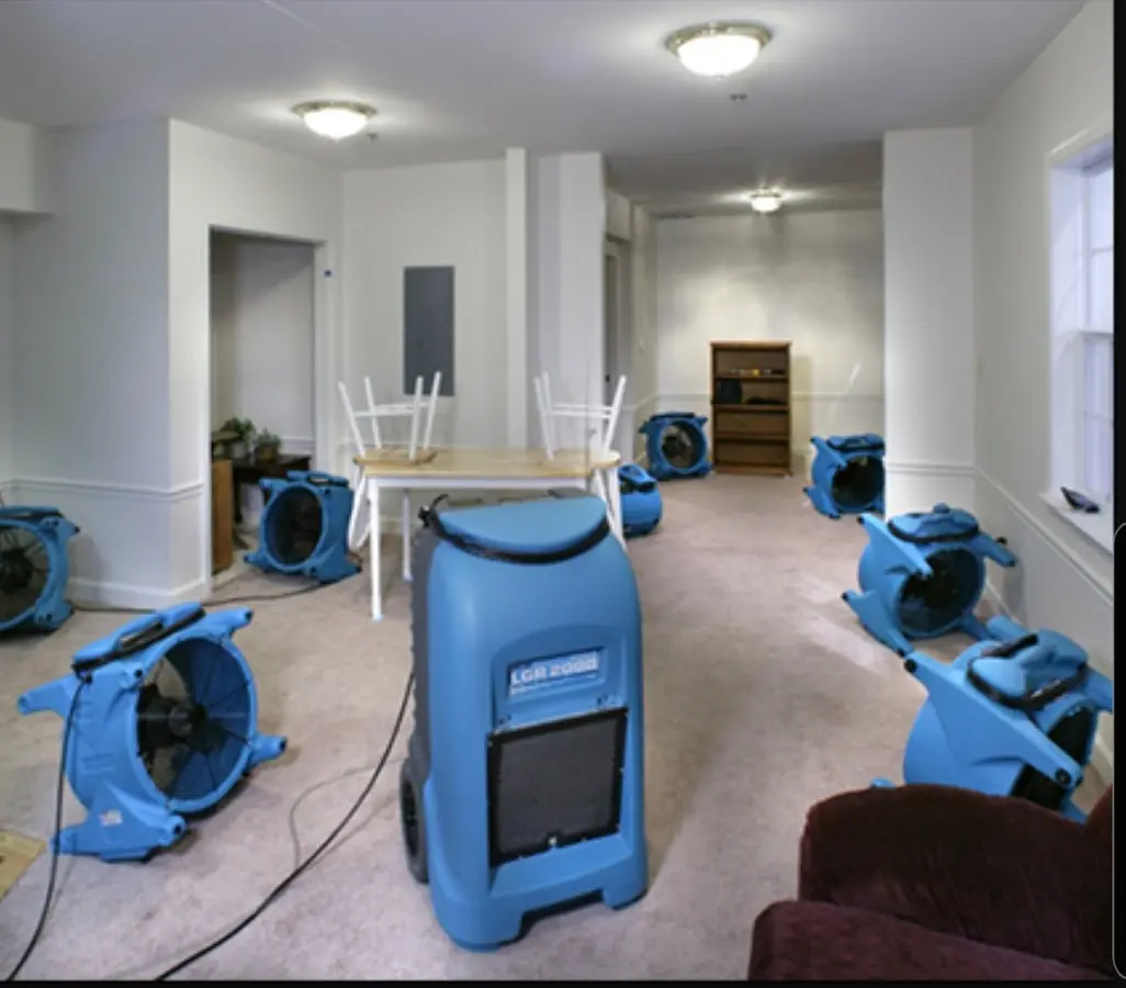 Air movers and dehumidifier setup for Water Damage Restoration in Milton